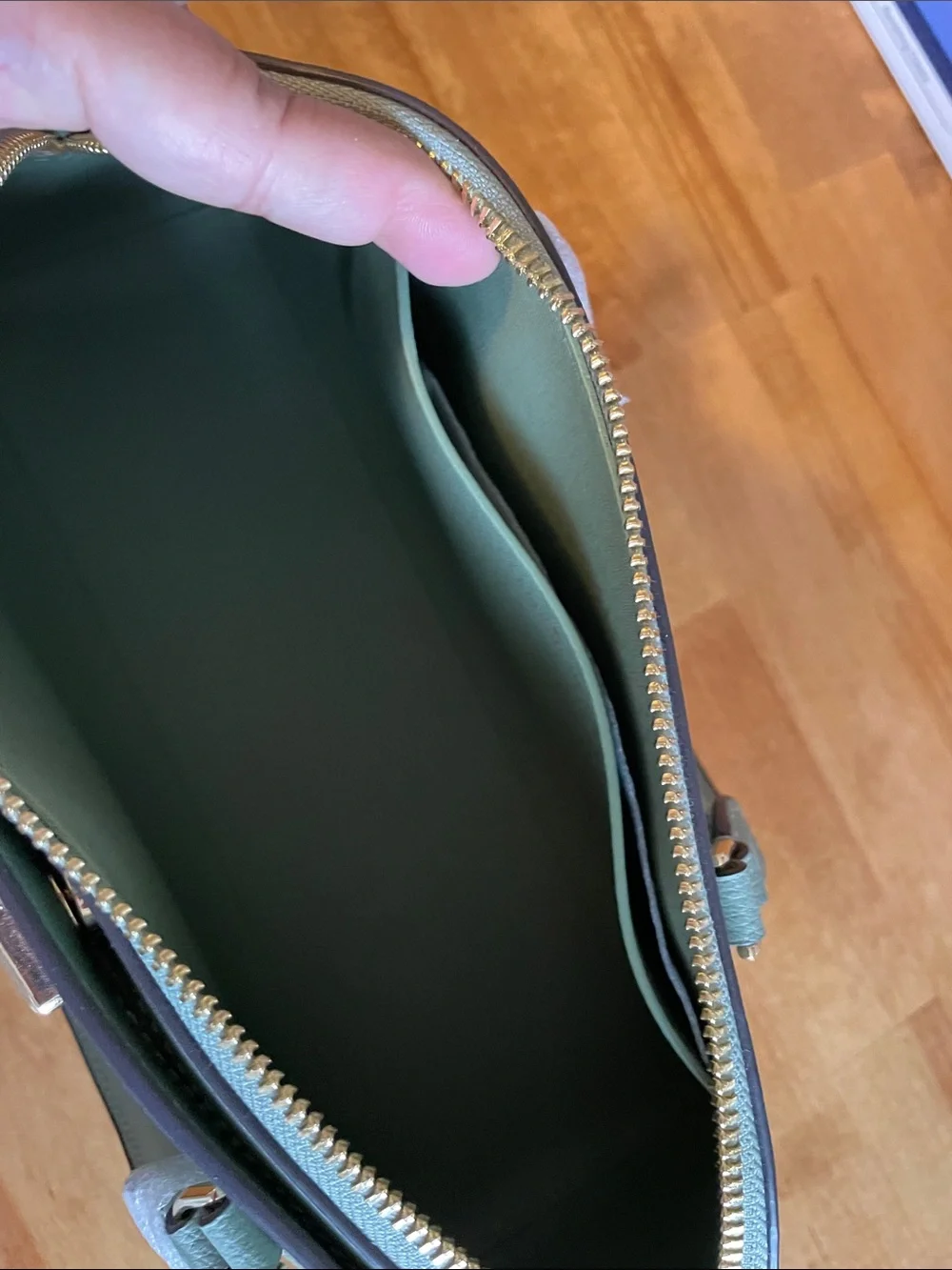 The Kate Spade KK114 refers specifically to the Phoebe East West Satchel